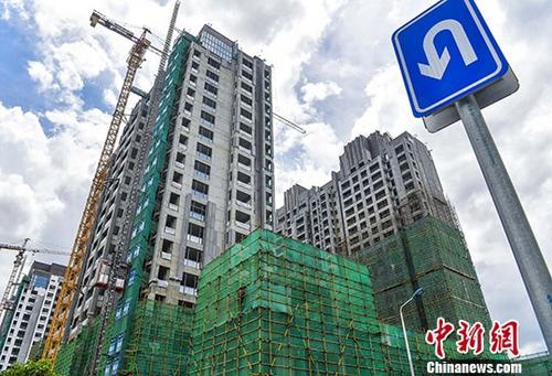 建设中的楼盘(资料图)。 <a target='_blank'  data-cke-saved-href='http://www.chinanews.com/' href='http://www.chinanews.com/'>中新社</a>记者 骆云飞 摄